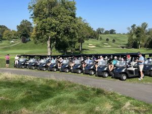 line of golf carts ready to go